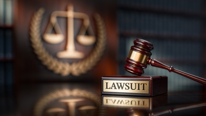 Chicago class action lawyers - Lawsuit: Judge's Gavel as a symbol of legal system and wooden stand with text word.