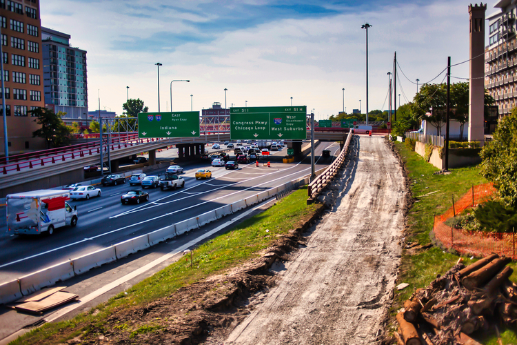 Chicago Car Accident Lawyer - highway surrounding the city of Chicago with busy traffic and road work occuring