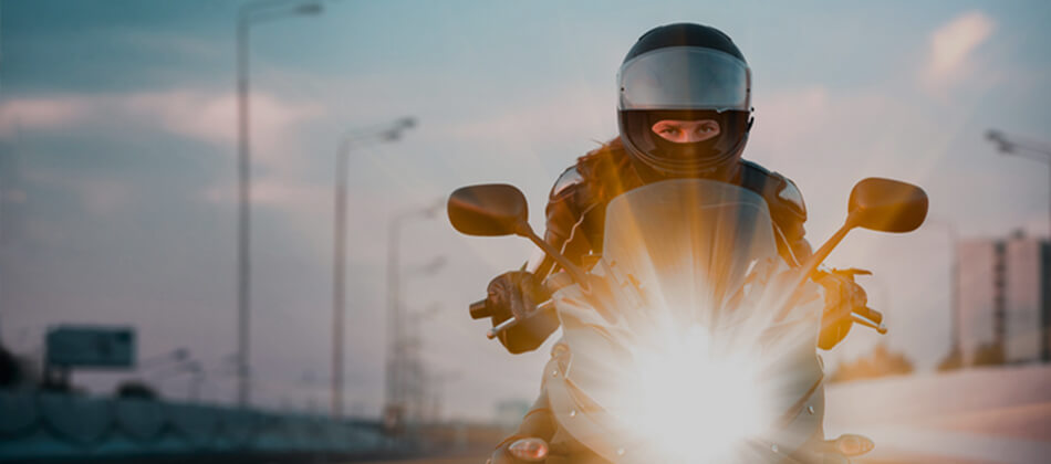 Man riding motorcycle wearing helmet