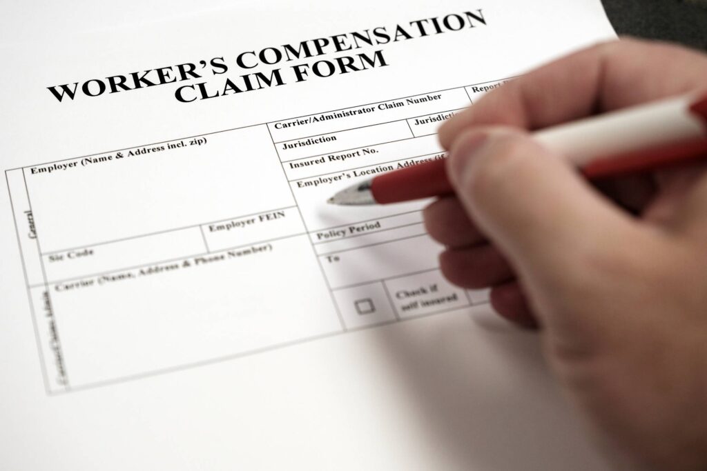 Joliet Workers Compensation Attorney - Workers Compensation Complaint Form Hand signing document