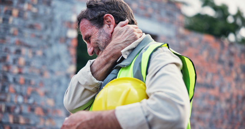 construction worker easing neck pain from construction injury, work site accident - what is the average workers’ comp neck injury settlement?