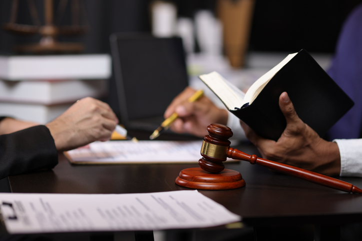 lawyer with client at a hearing - How to win a workers' comp hearing in Chicago