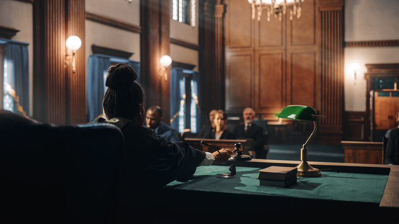 courtroom with judge ruling out a decision - when does a case go to trial?