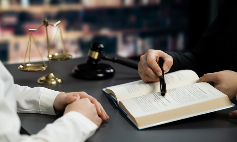 trial ready lawyer with client - why trial readiness drives higher settlements