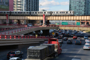 a cargo truck in rush hour traffic in Chicago, IL - How do you negotiate a Chicago truck accident settlement?