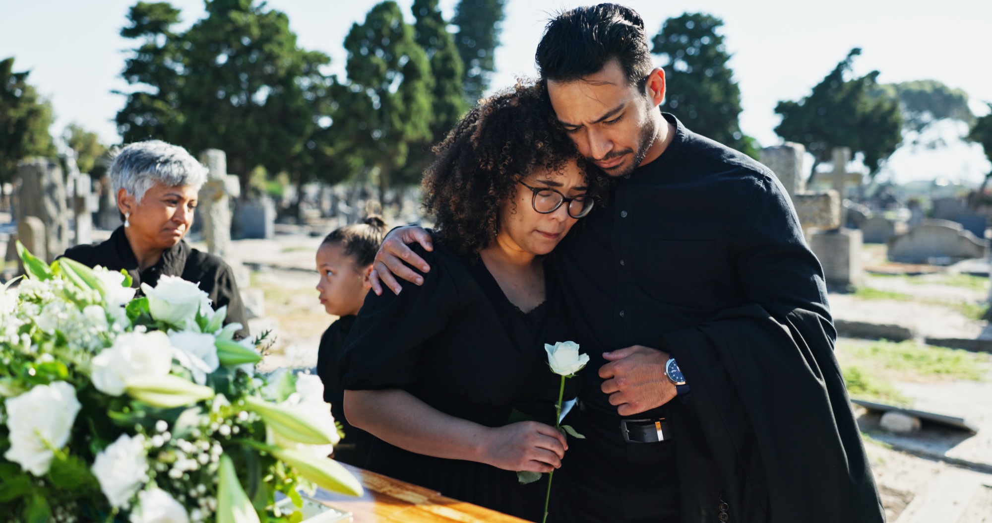 Chicago wrongful death lawyer - Hugging and grieving family attending a funeral